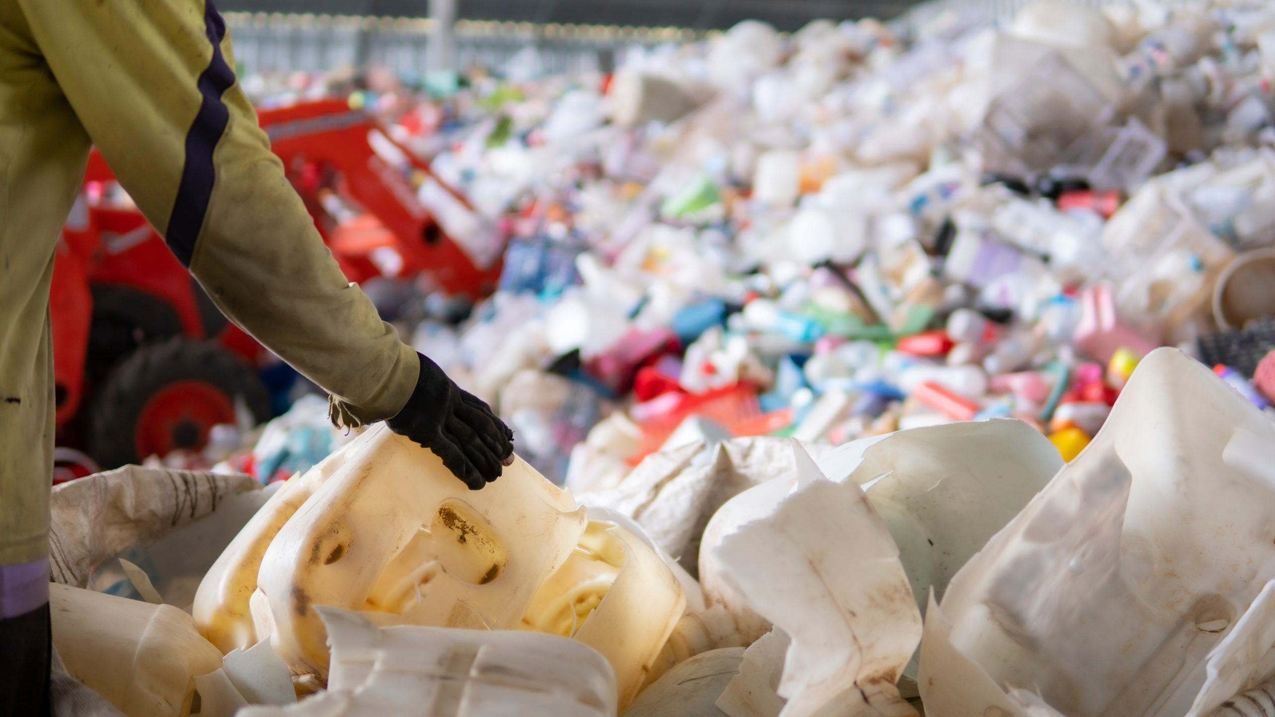 Workers are sorting plastic waste in the garbage factory
